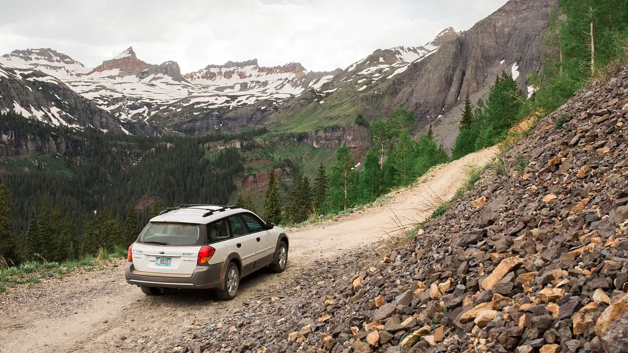 A rough road climbing toward the peaks in the San Juan National Forest, Colorado